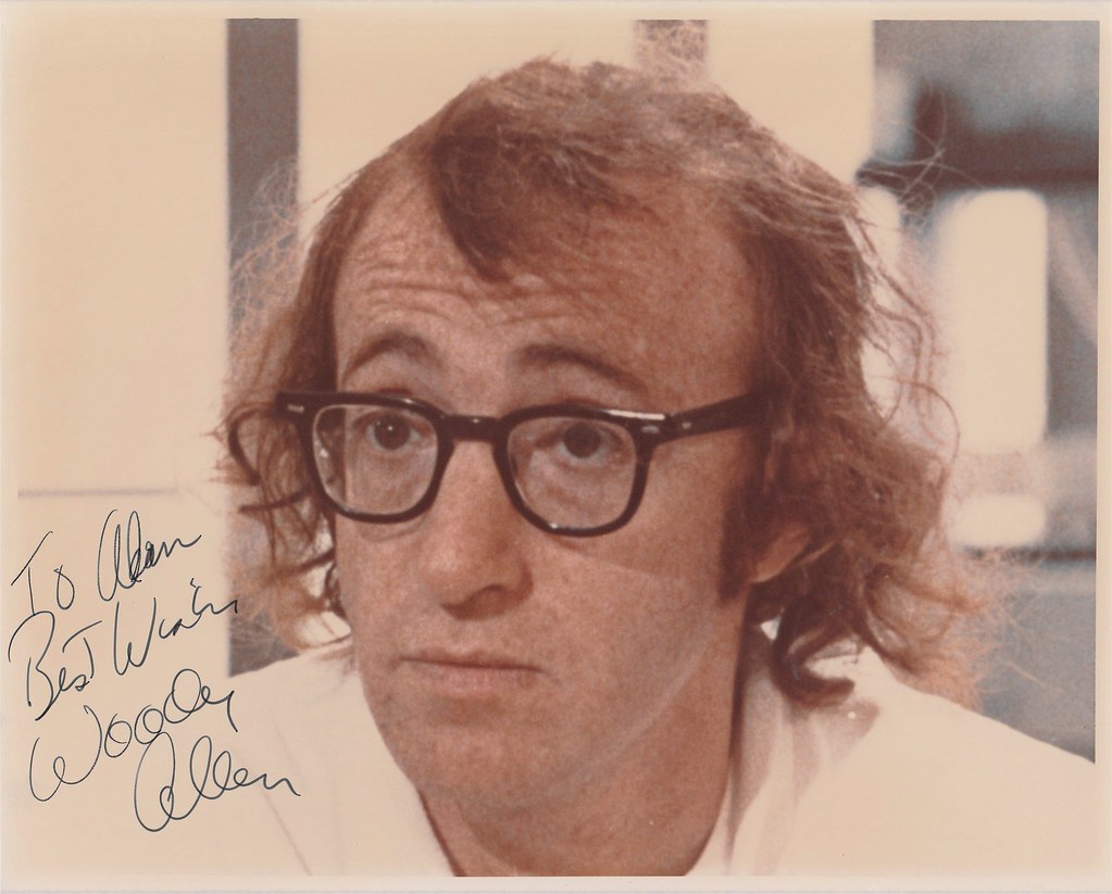 A signed publicity photograph of Woody Allen, inscribed “To Alan, best wishes”