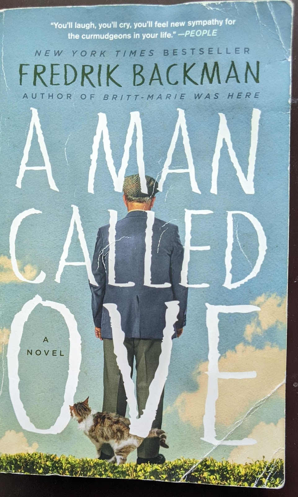 A creased paperback of A Man Called Ove by Fredrik Backman