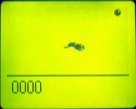 The Snake game on a monochrome handheld screen